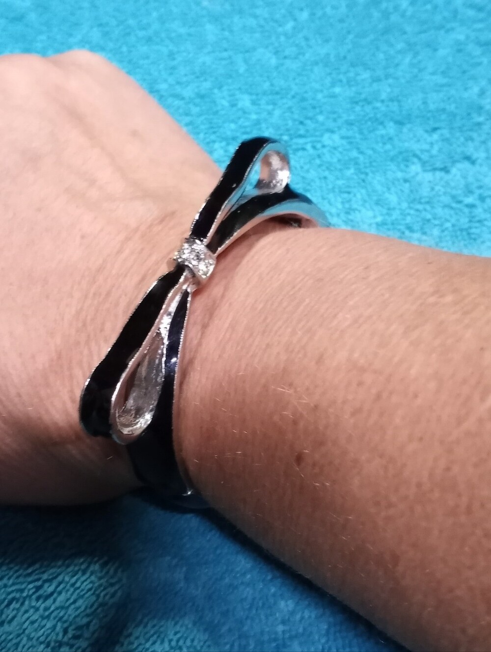 Silver Bow Hinge Bracelet with Black Enamel And Crystal Accents